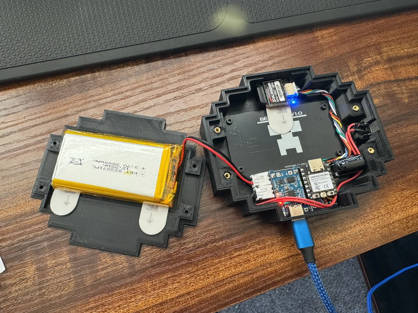 Open enclosure showing battery, GPS, and custom board