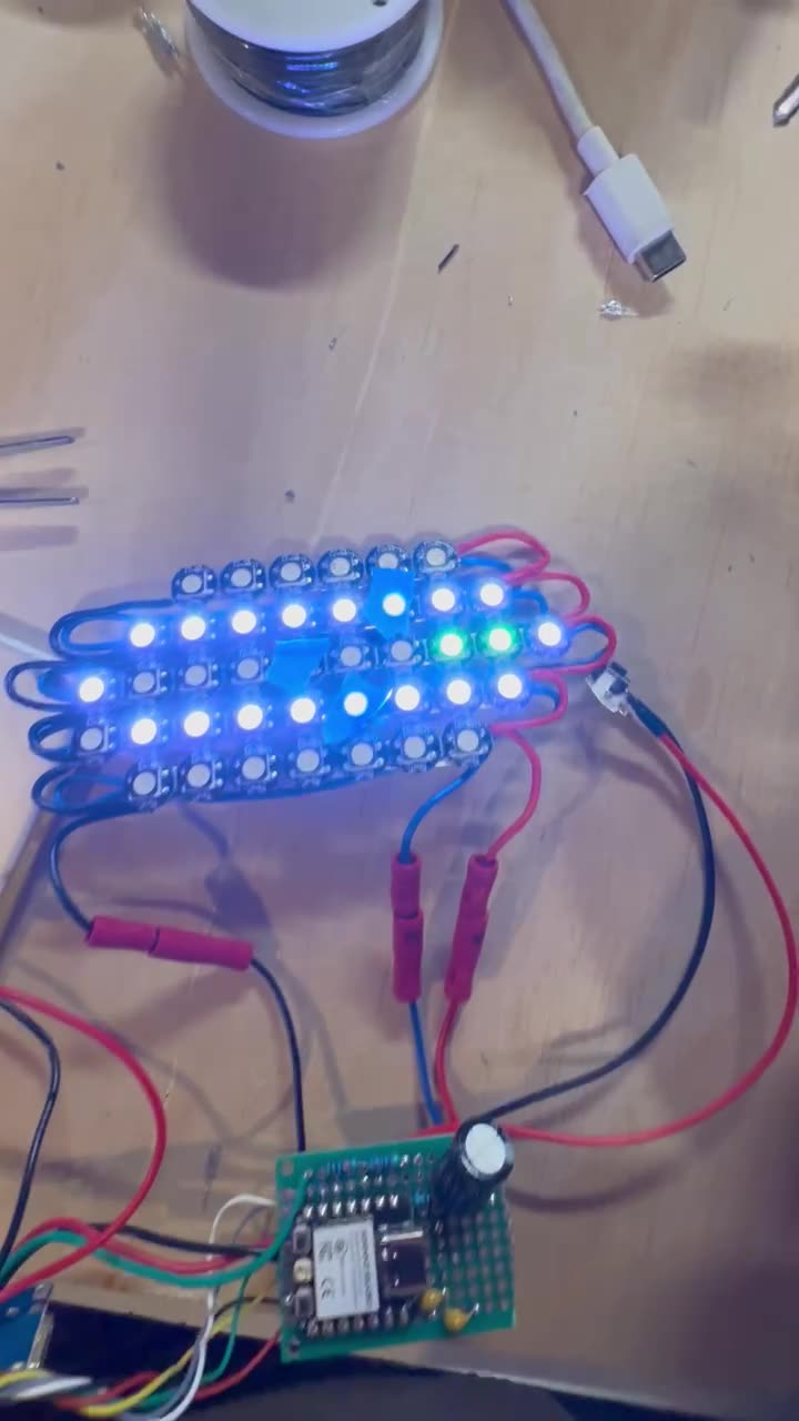 Proto 1 LED grid lighting up on the bench